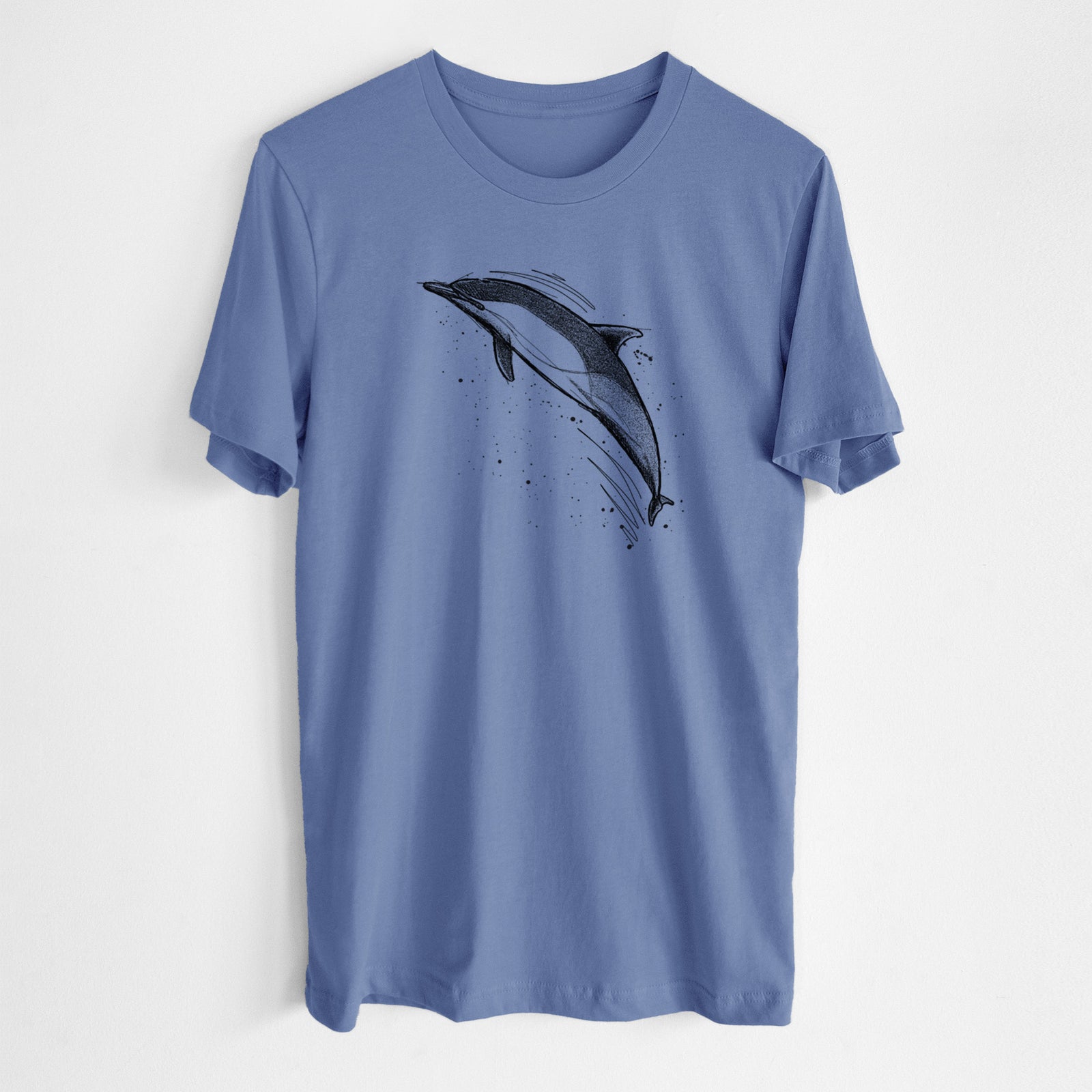 Blue bell lightweight cotton t-shirt laid flat, printed with a black ink illustration of a common dolphin leaping, with ink splatters.