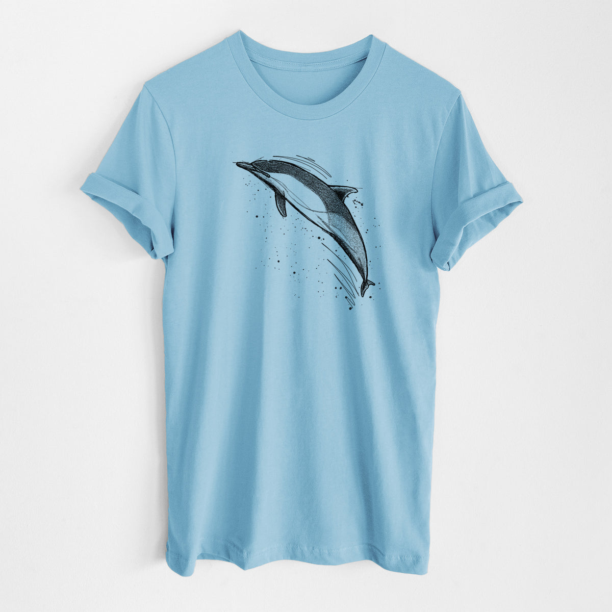 Ocean blue lightweight cotton t-shirt laid flat, printed with a black ink illustration of a common dolphin leaping, with ink splatters.
