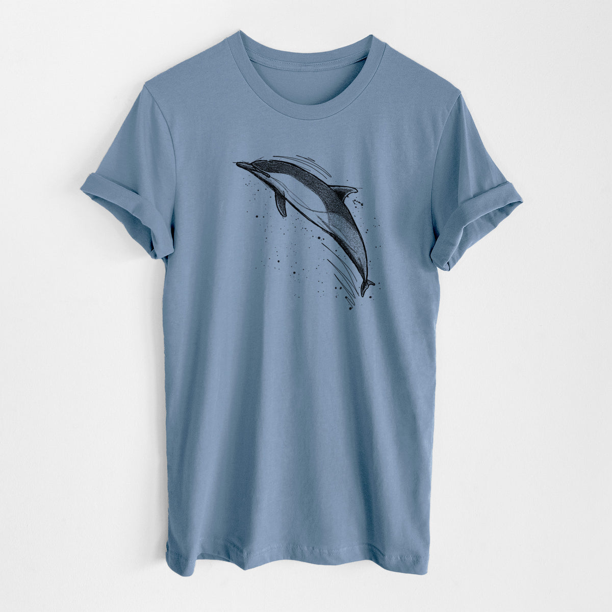 Steel blue lightweight cotton t-shirt laid flat, printed with a black ink illustration of a common dolphin leaping, with ink splatters.
