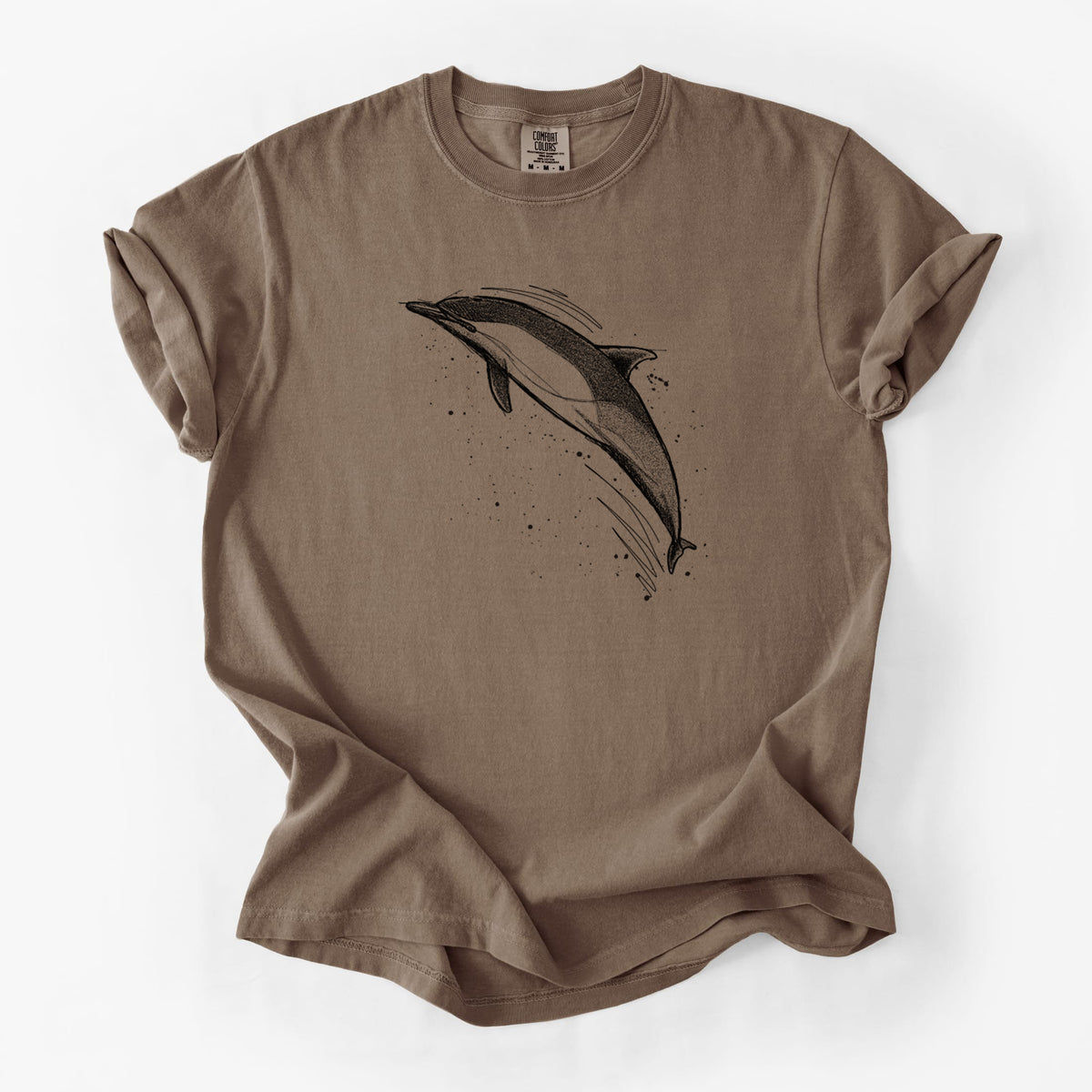 Espresso brown Comfort Colors t-shirt laid flat, printed with a black ink illustration of a common dolphin leaping, with ink splatters.
