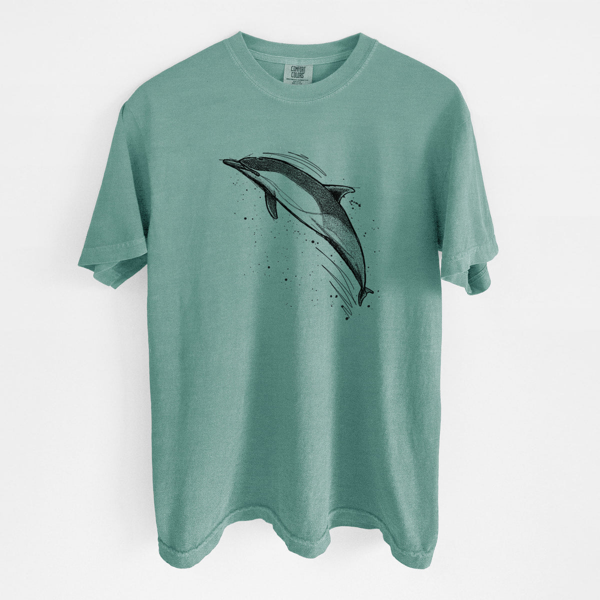 Reef green Comfort Colors t-shirt laid flat, printed with a black ink illustration of a common dolphin leaping, with ink splatters.