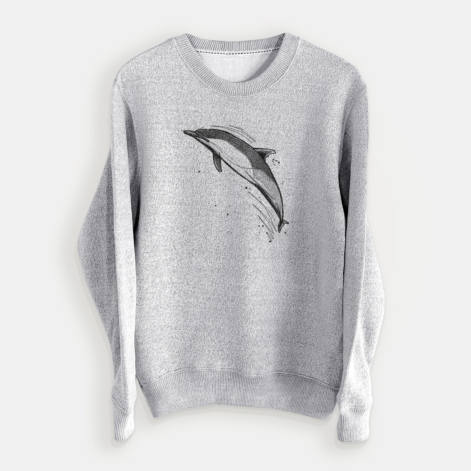 Salt and pepper knit sweatshirt laid flat, printed with a black ink illustration of a common dolphin leaping, with ink splatters.