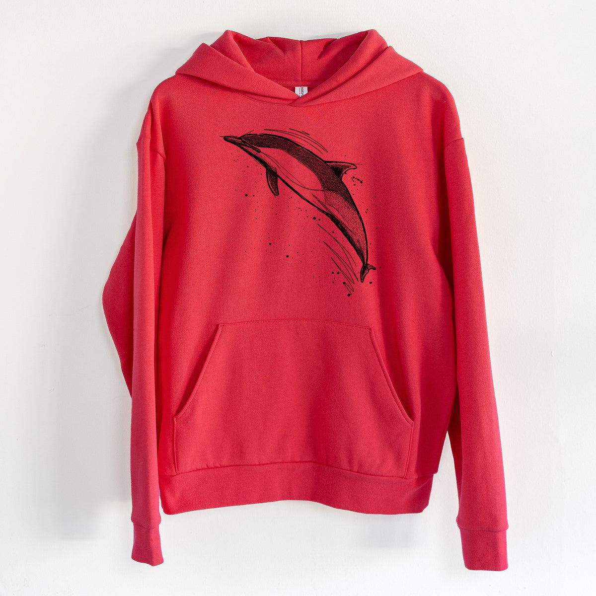 Short-Beaked Common Dolphin - Delphinus delphis - Statement Midweight Hoodie in Cherry Red, hanging on a white wall, with a front kangaroo pocket and no drawcords.