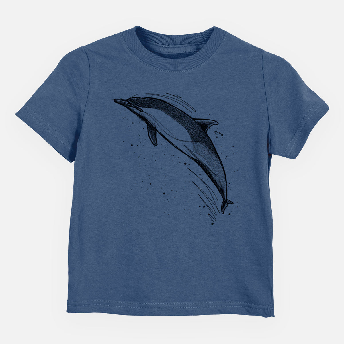Indigo blue toddler t-shirt laid flat, printed with a black ink illustration of a common dolphin leaping, with ink splatters.
