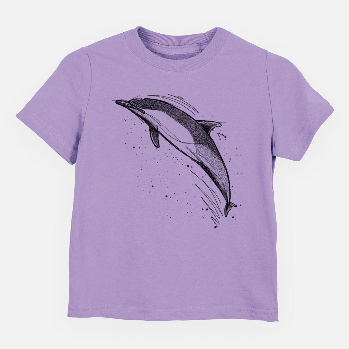 Lavender toddler t-shirt laid flat, printed with a black ink illustration of a common dolphin leaping, with ink splatters.