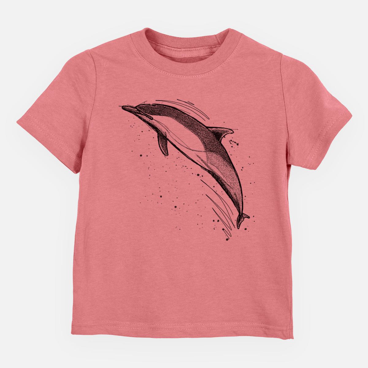 Mauve pink toddler t-shirt laid flat, printed with a black ink illustration of a common dolphin leaping, with ink splatters.