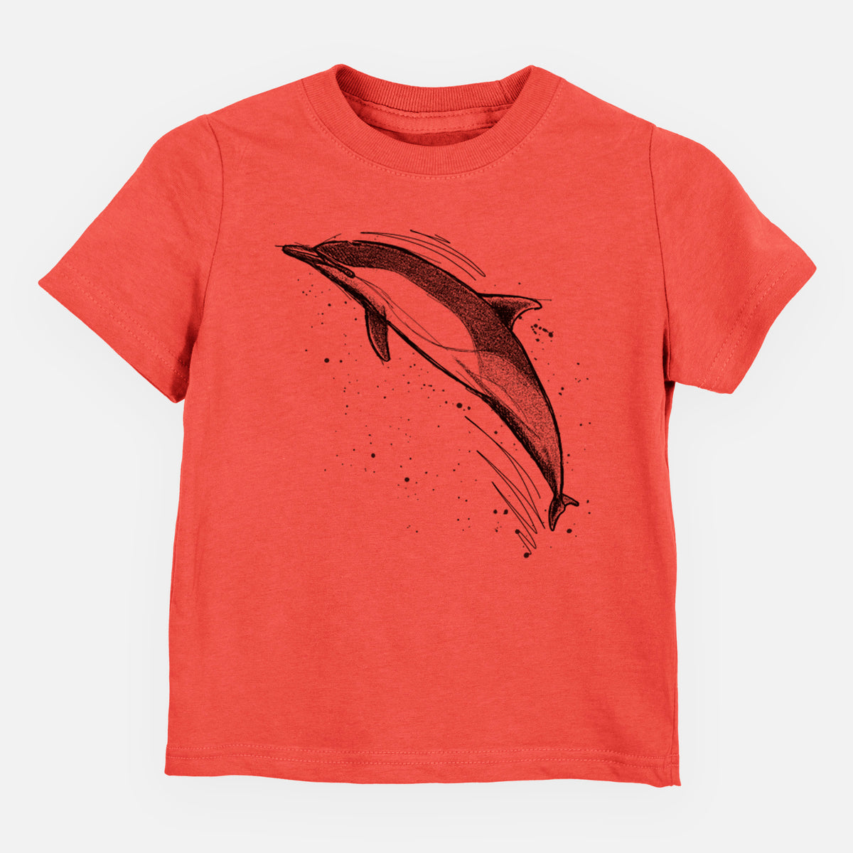 Passionfruit pink toddler t-shirt laid flat, printed with a black ink illustration of a common dolphin leaping, with ink splatters.