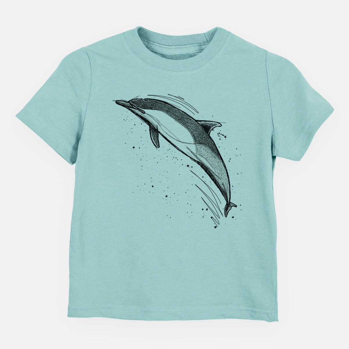 Saltwater toddler t-shirt laid flat, printed with a black ink illustration of a common dolphin leaping, with ink splatters.