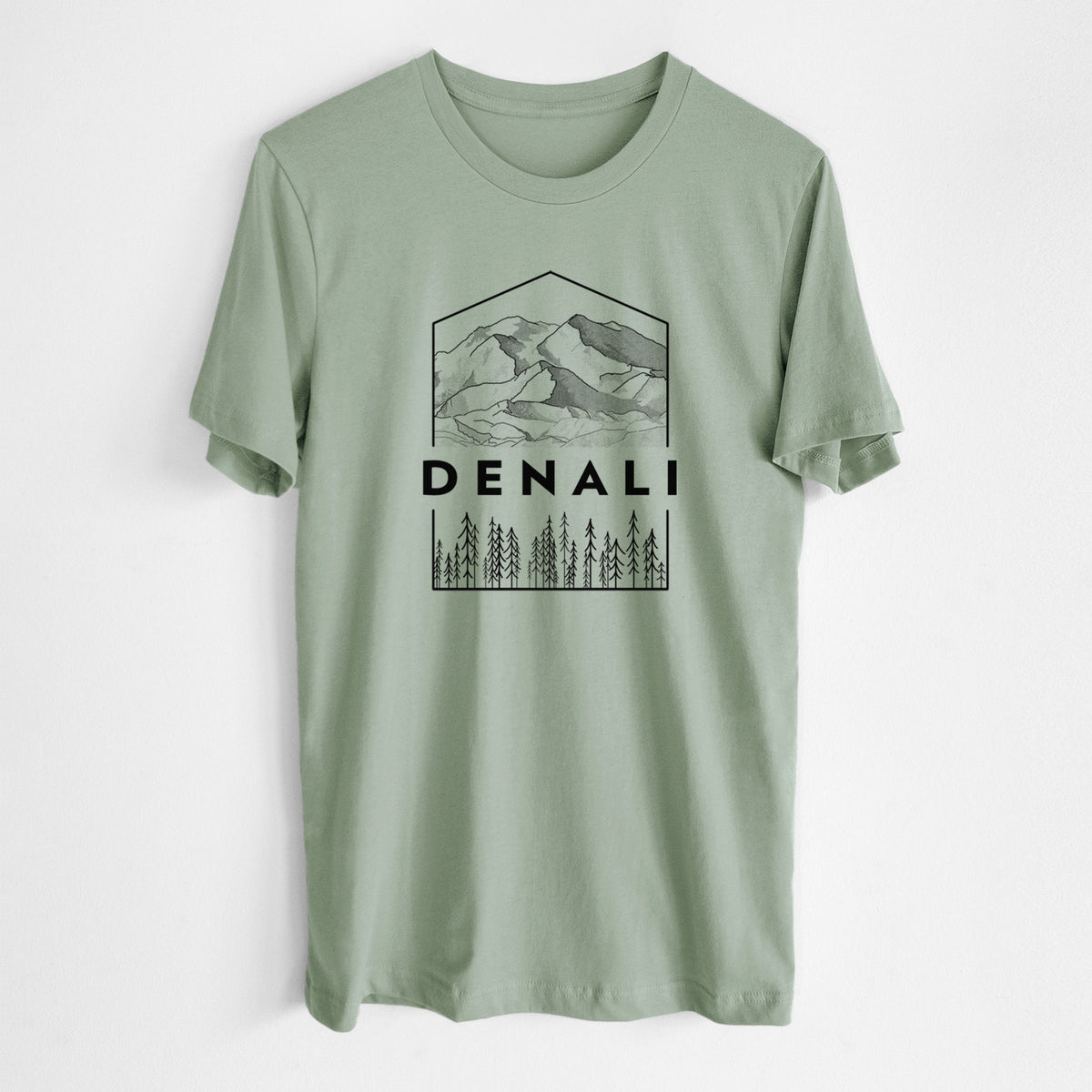 Sage green lightweight cotton t-shirt laid flat, printed with a black line art badge of the Denali mountain range above pine trees, with the word Denali.