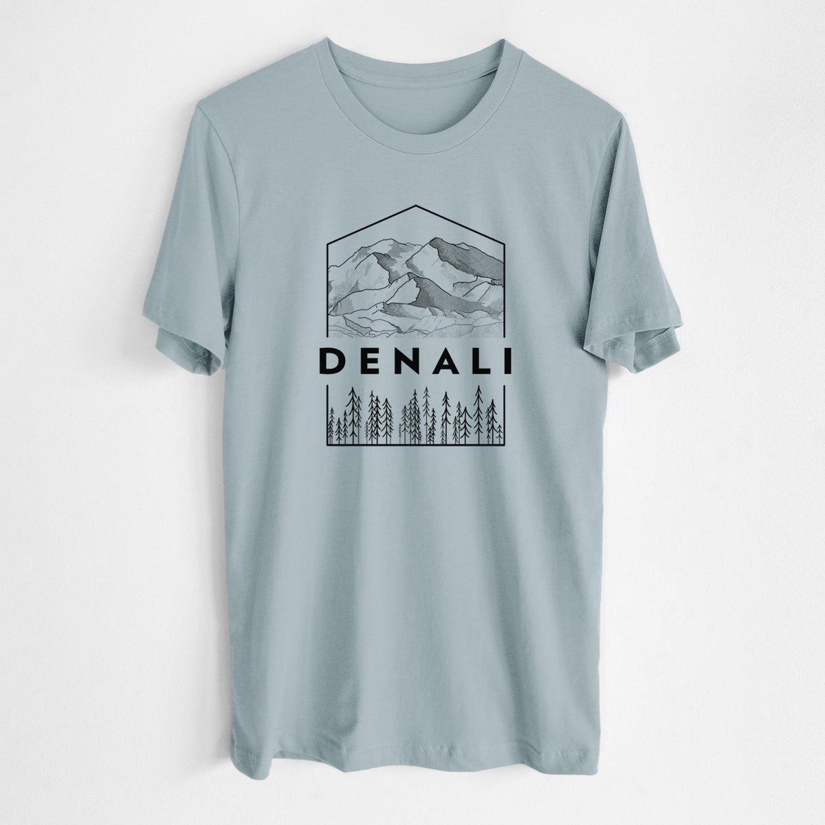 Vintage denim lightweight cotton t-shirt laid flat, printed with a black line art badge of the Denali mountain range above pine trees, with the word Denali.