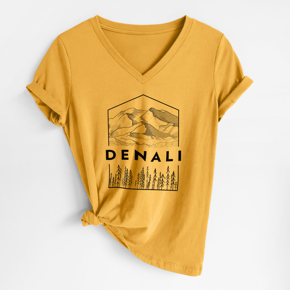 Honeycomb yellow women's relaxed fit cotton V-neck t-shirt laid flat, printed with a black line art badge of the Denali mountain range above pine trees, with the word Denali.
