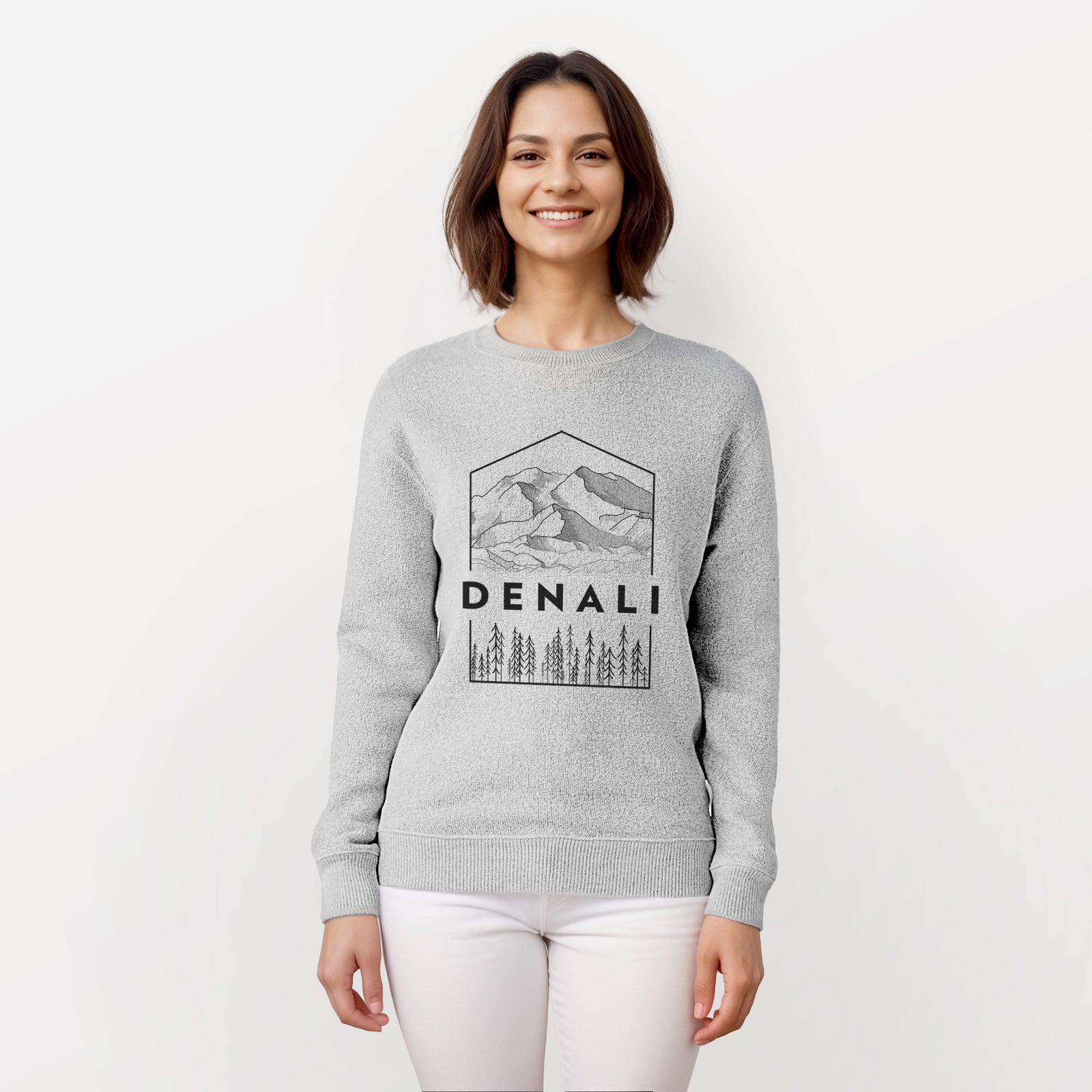 Salt and pepper knit sweatshirt laid flat, printed with a black line art badge of the Denali mountain range above pine trees, with the word Denali.