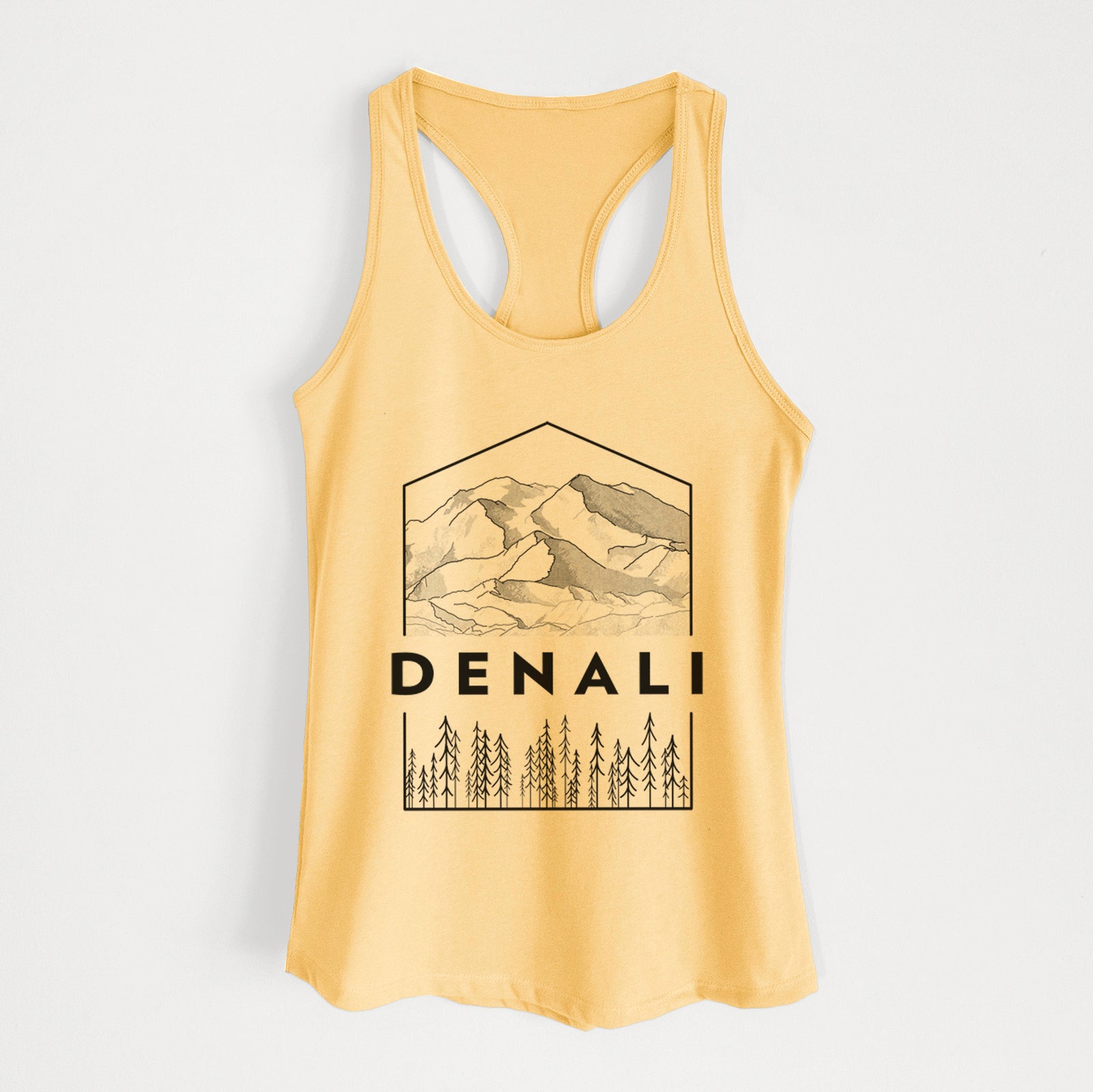 Banana cream women's racerback tank top laid flat, printed with a black line art badge of the Denali mountain range above pine trees, with the word Denali.