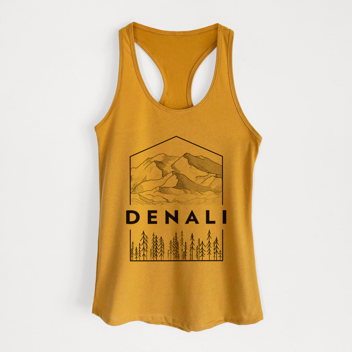 Gold women's racerback tank top laid flat, printed with a black line art badge of the Denali mountain range above pine trees, with the word Denali.