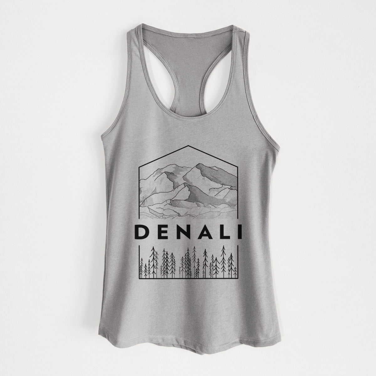 Heather grey women's racerback tank top laid flat, printed with a black line art badge of the Denali mountain range above pine trees, with the word Denali.
