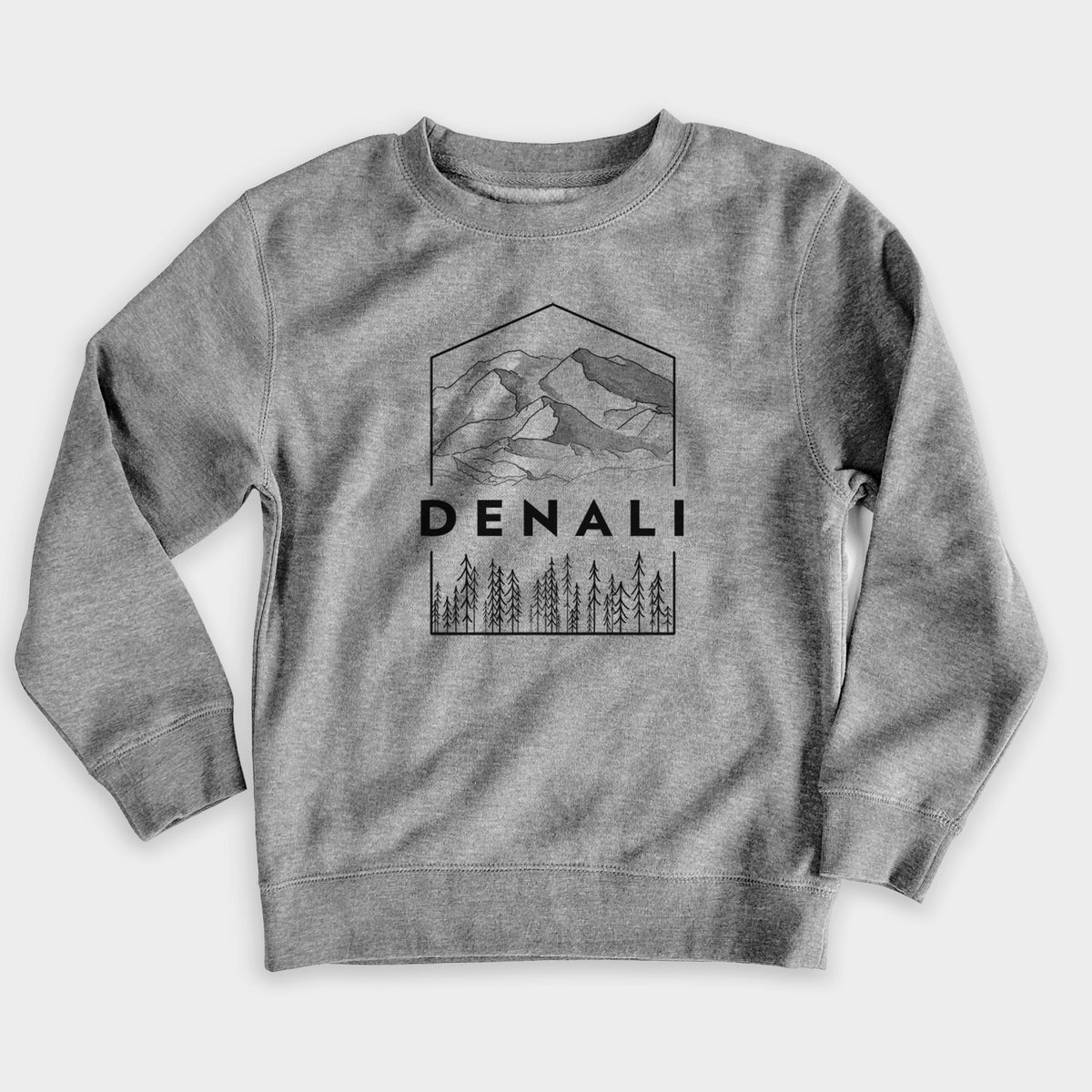 Nickel grey youth crewneck sweatshirt laid flat, printed with a black line art badge of the Denali mountain range above pine trees, with the word Denali.