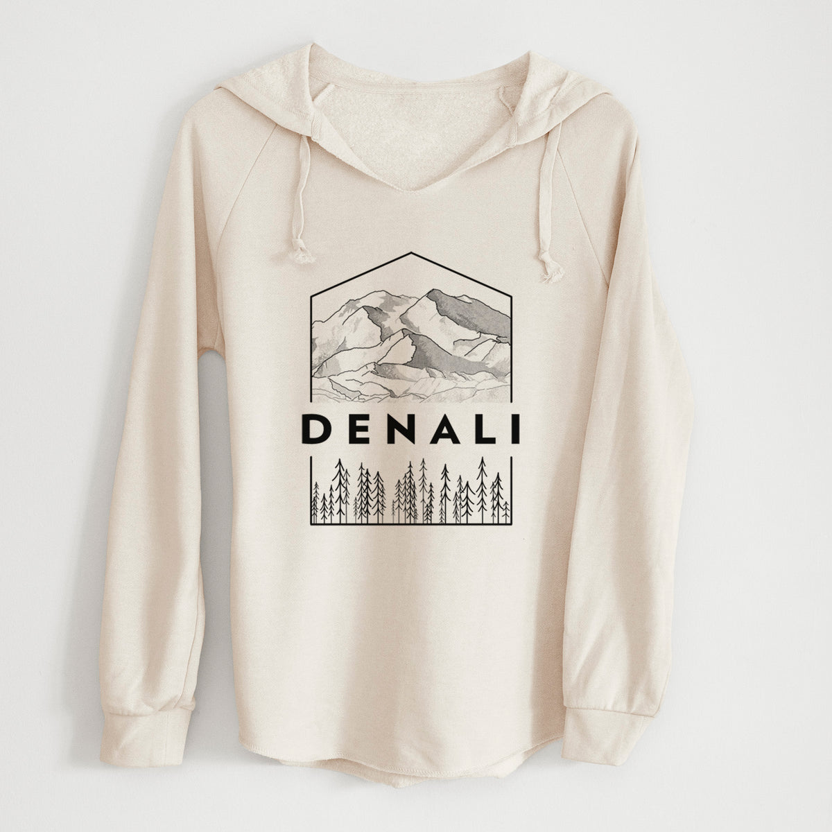 Bone cream women's Cali Wave hooded sweatshirt laid flat, printed with a black line art badge of the Denali mountain range above pine trees, with the word Denali.