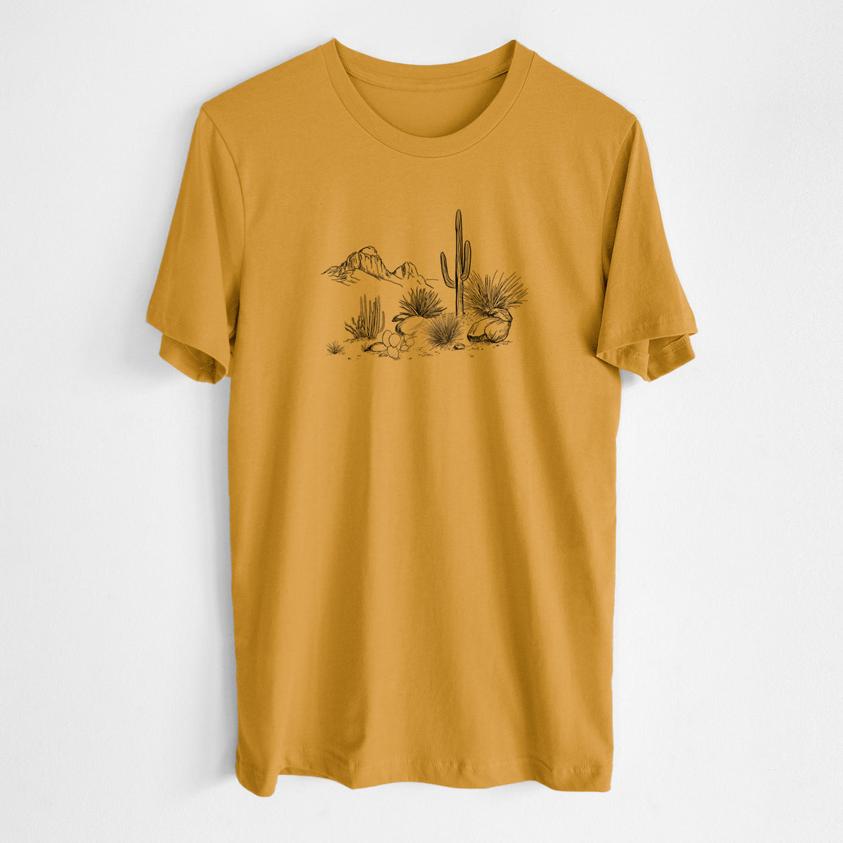 Honeycomb yellow lightweight cotton t-shirt laid flat, printed with a black ink desert scene with a saguaro cactus, agave, rocks and distant mountains.