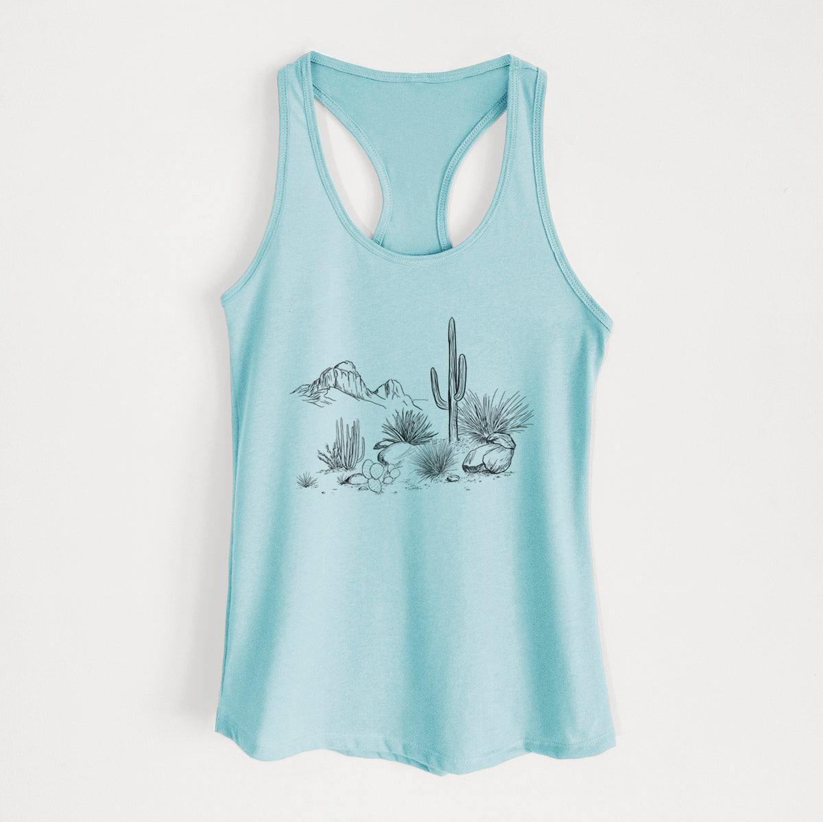 Cancun blue women's racerback tank top laid flat, printed with a black ink desert scene with a saguaro cactus, agave, rocks and distant mountains.