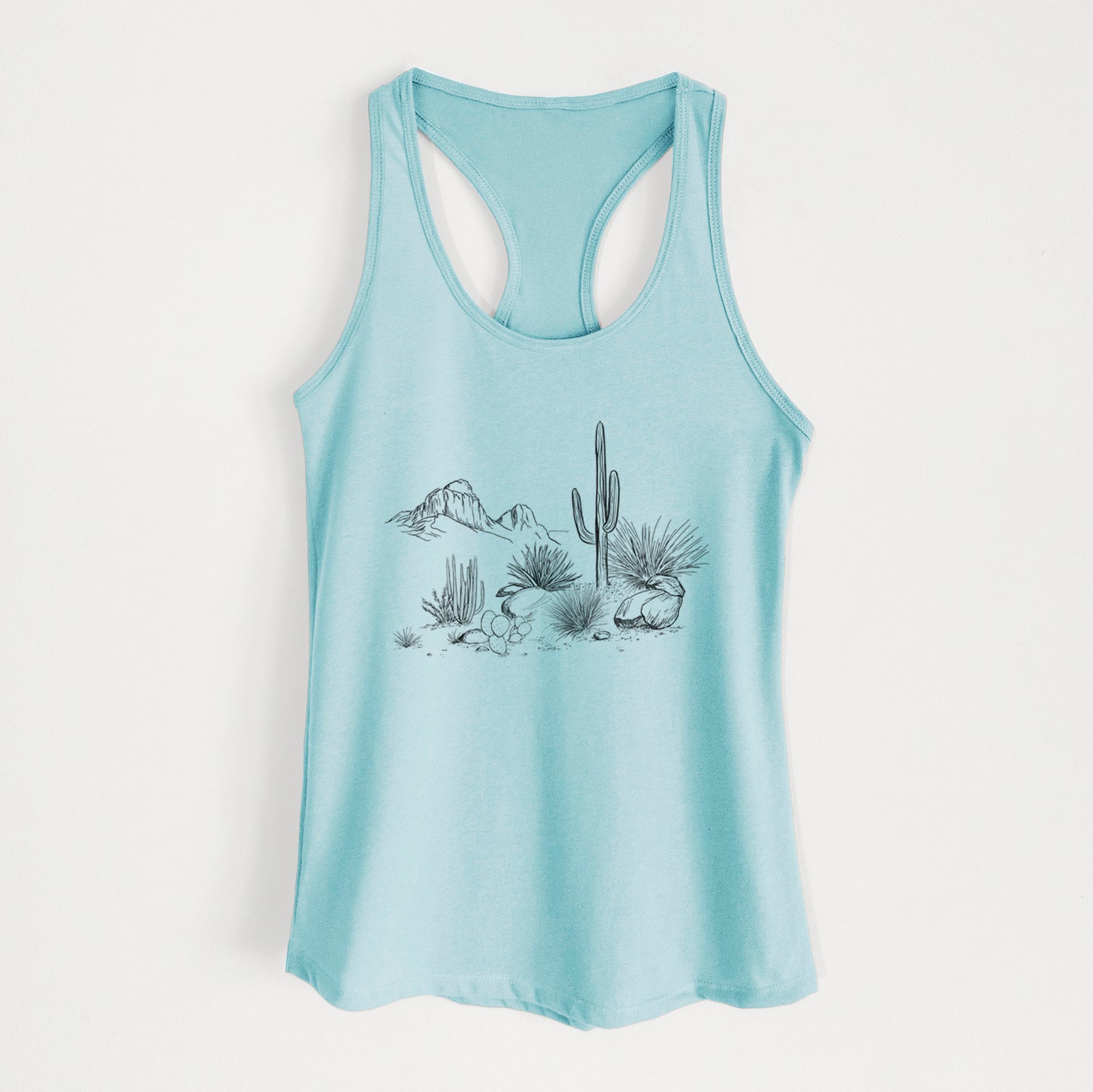 Banana cream women's racerback tank top laid flat, printed with a black ink desert scene with a saguaro cactus, agave, rocks and distant mountains.