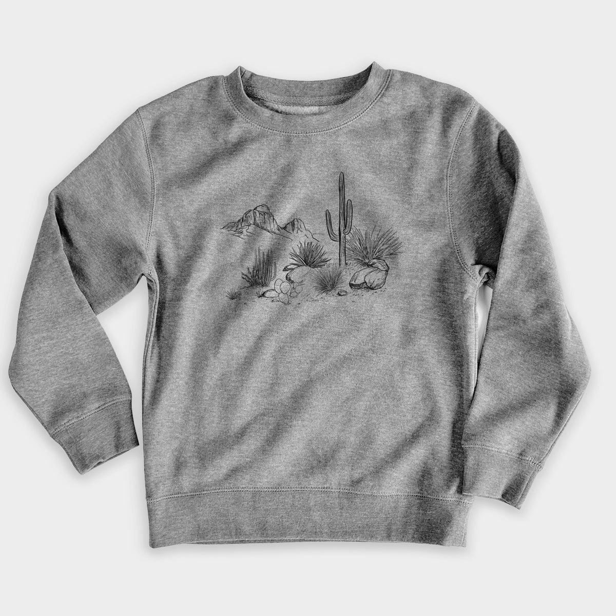 Nickel grey youth crewneck sweatshirt laid flat, printed with a black ink desert scene with a saguaro cactus, agave, rocks and distant mountains.