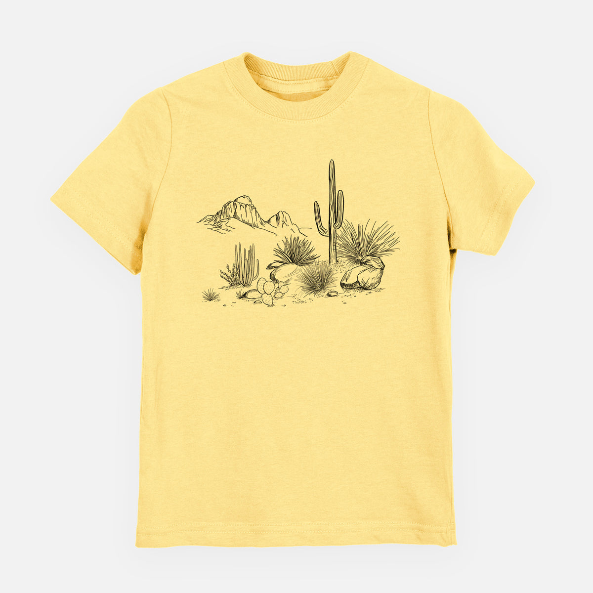 Butter yellow youth t-shirt laid flat, printed with a black ink desert scene with a saguaro cactus, agave, rocks and distant mountains.
