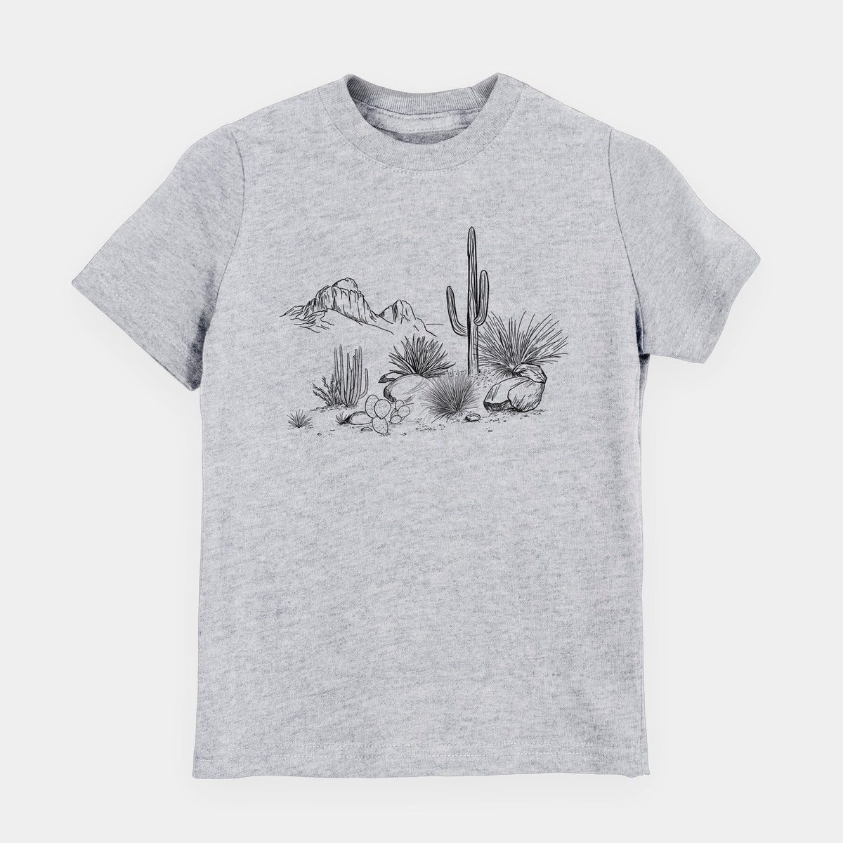 Heather grey youth t-shirt laid flat, printed with a black ink desert scene with a saguaro cactus, agave, rocks and distant mountains.