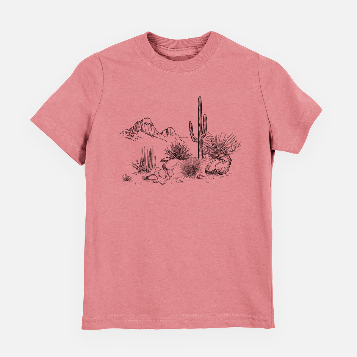 Mauve pink youth t-shirt laid flat, printed with a black ink desert scene with a saguaro cactus, agave, rocks and distant mountains.
