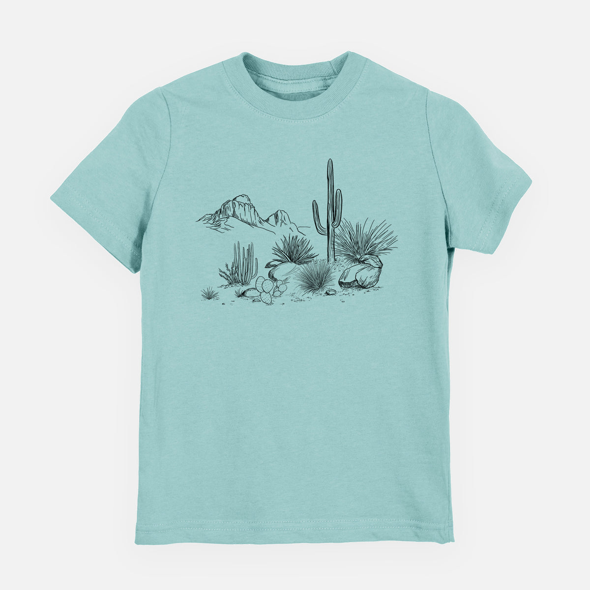 Saltwater youth t-shirt laid flat, printed with a black ink desert scene with a saguaro cactus, agave, rocks and distant mountains.