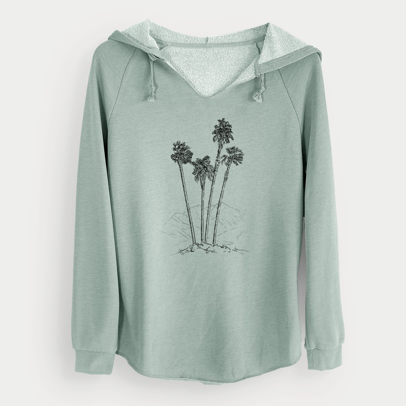 Sage green women's Cali Wave hooded sweatshirt laid flat, printed with a black ink illustration of a cluster of tall desert palm trees.