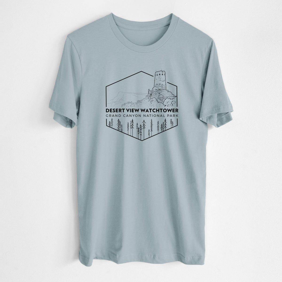 Vintage denim lightweight cotton t-shirt laid flat, printed with a black line art badge of the Desert View Watchtower above pine trees, with the words Desert View Watchtower, Grand Canyon National Park.