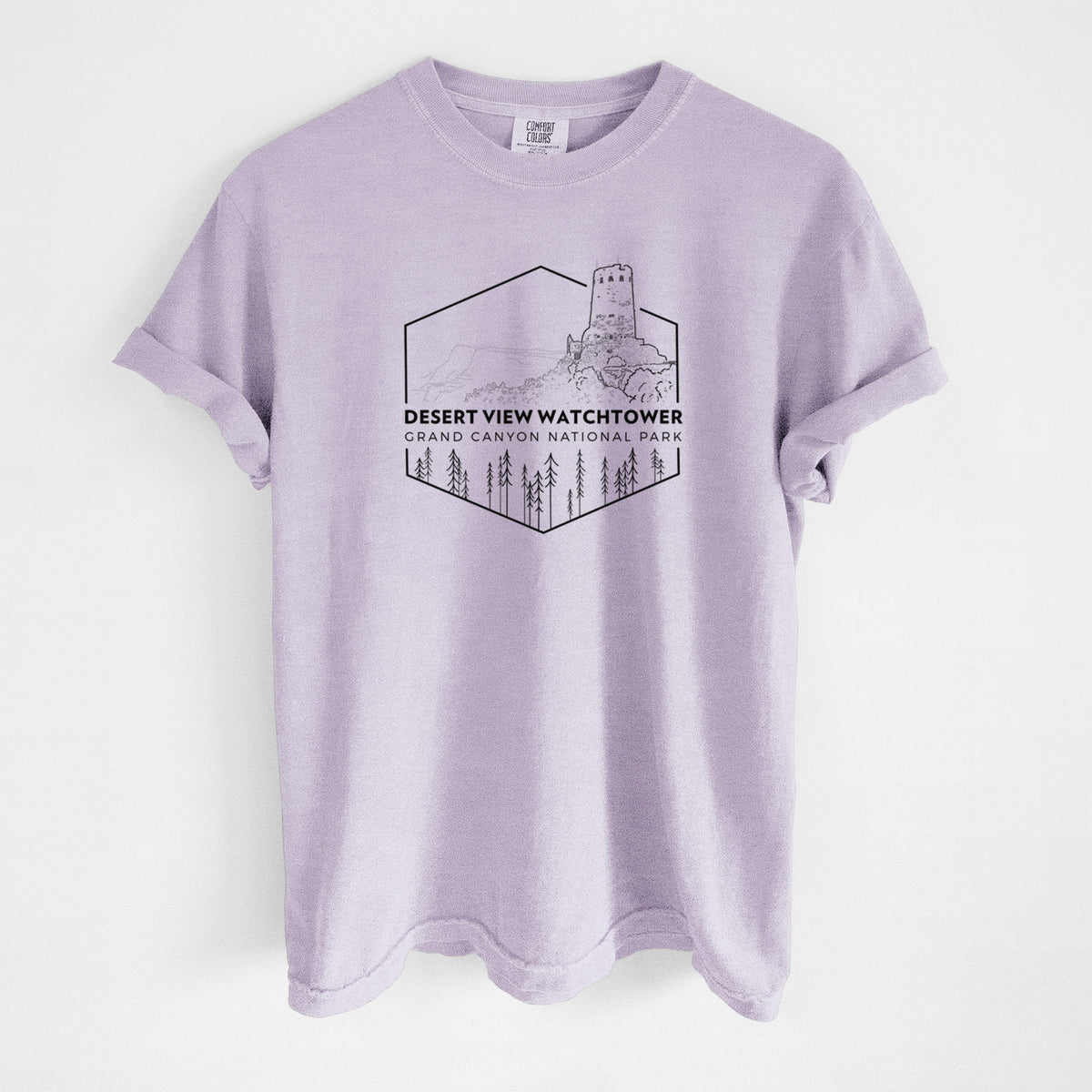 Orchid purple Comfort Colors t-shirt laid flat, printed with a black line art badge of the Desert View Watchtower above pine trees, with the words Desert View Watchtower, Grand Canyon National Park.