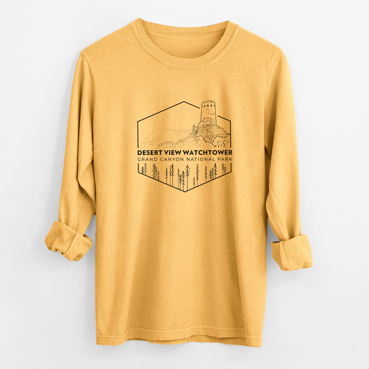 Golden wheat yellow Comfort Colors long sleeve shirt laid flat with the cuffs rolled, printed with a black line art badge of the Desert View Watchtower above pine trees, with the words Desert View Watchtower, Grand Canyon National Park.