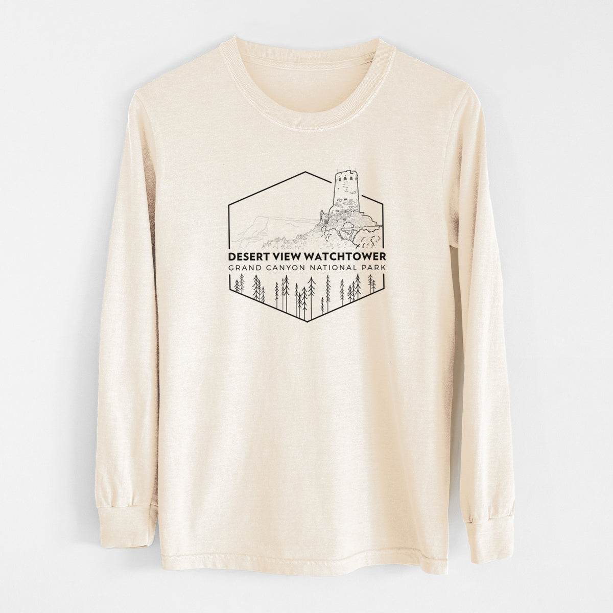 Ivory Comfort Colors long sleeve shirt laid flat, printed with a black line art badge of the Desert View Watchtower above pine trees, with the words Desert View Watchtower, Grand Canyon National Park.