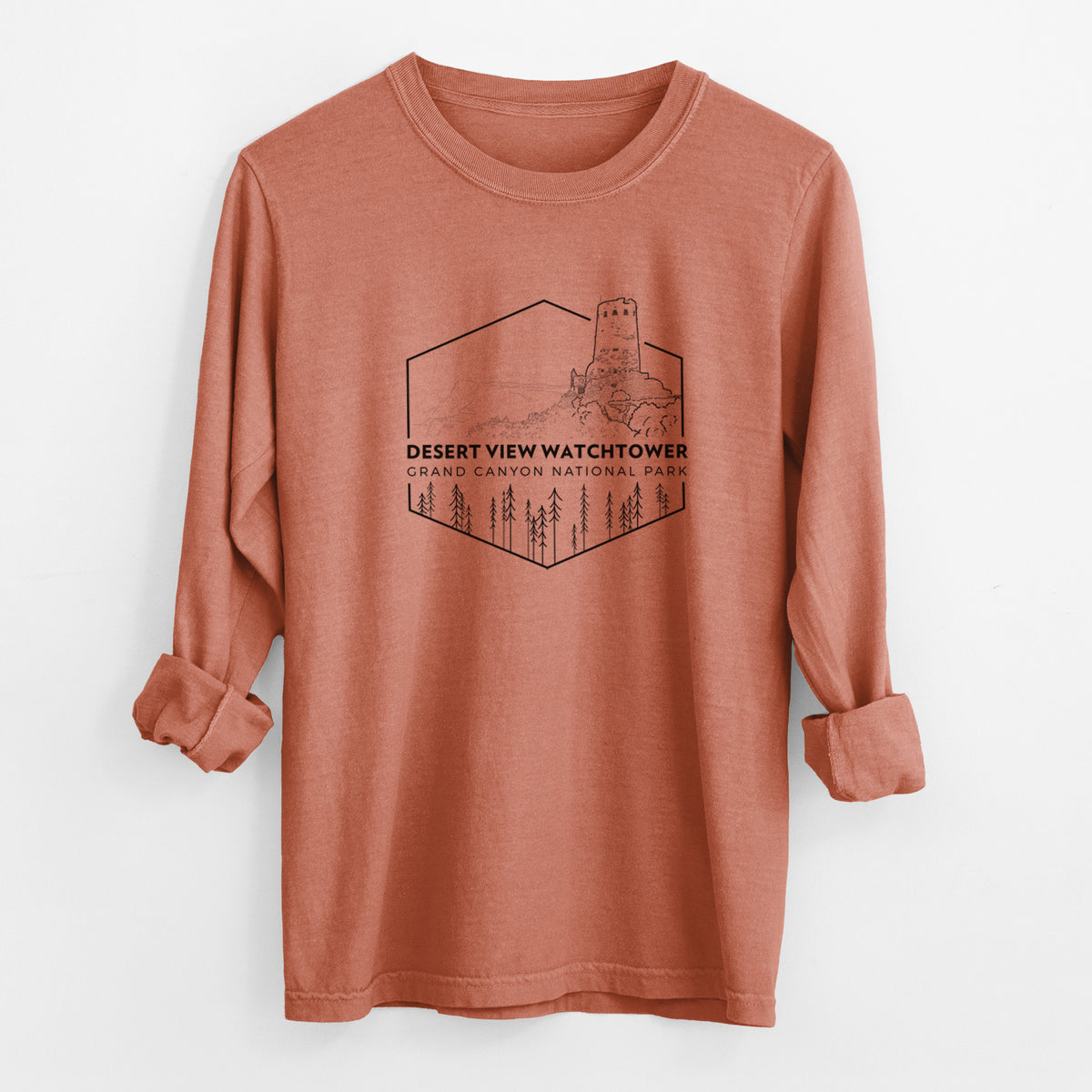 Yam burnt orange Comfort Colors long sleeve shirt laid flat with the cuffs rolled, printed with a black line art badge of the Desert View Watchtower above pine trees, with the words Desert View Watchtower, Grand Canyon National Park.