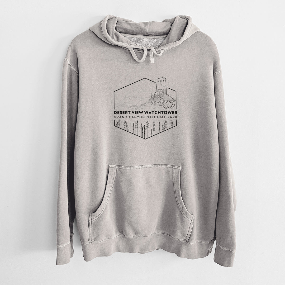 Cement grey pigment dyed hoodie laid flat, printed with a black line art badge of the Desert View Watchtower above pine trees, with the words Desert View Watchtower, Grand Canyon National Park.