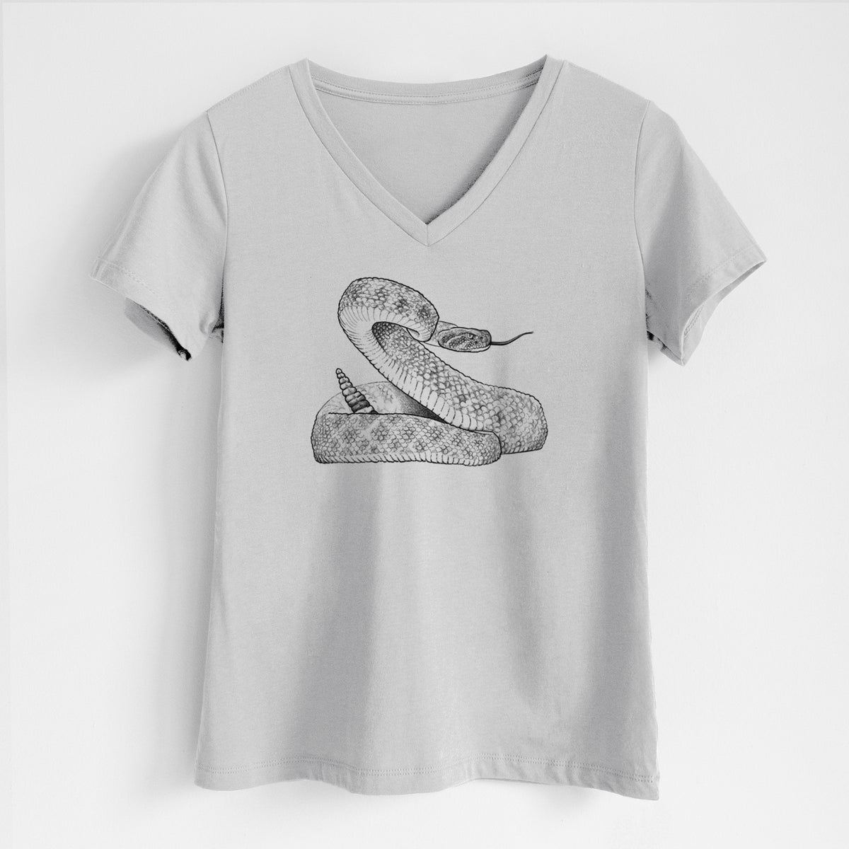 Lunar grey women's relaxed fit cotton V-neck t-shirt laid flat, printed with a detailed black ink illustration of a coiled diamondback rattlesnake.