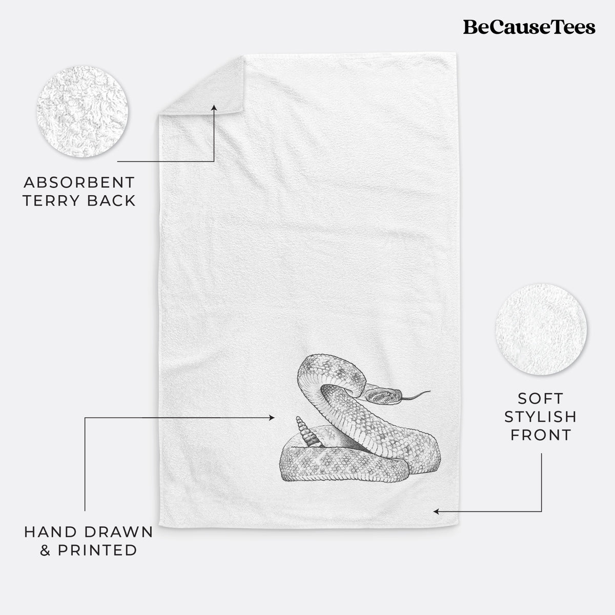 White hand towel printed with a detailed black ink illustration of a coiled diamondback rattlesnake.