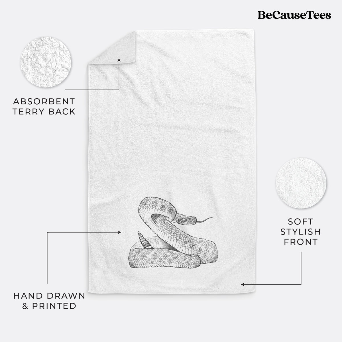 White hand towel printed with a detailed black ink illustration of a coiled diamondback rattlesnake.