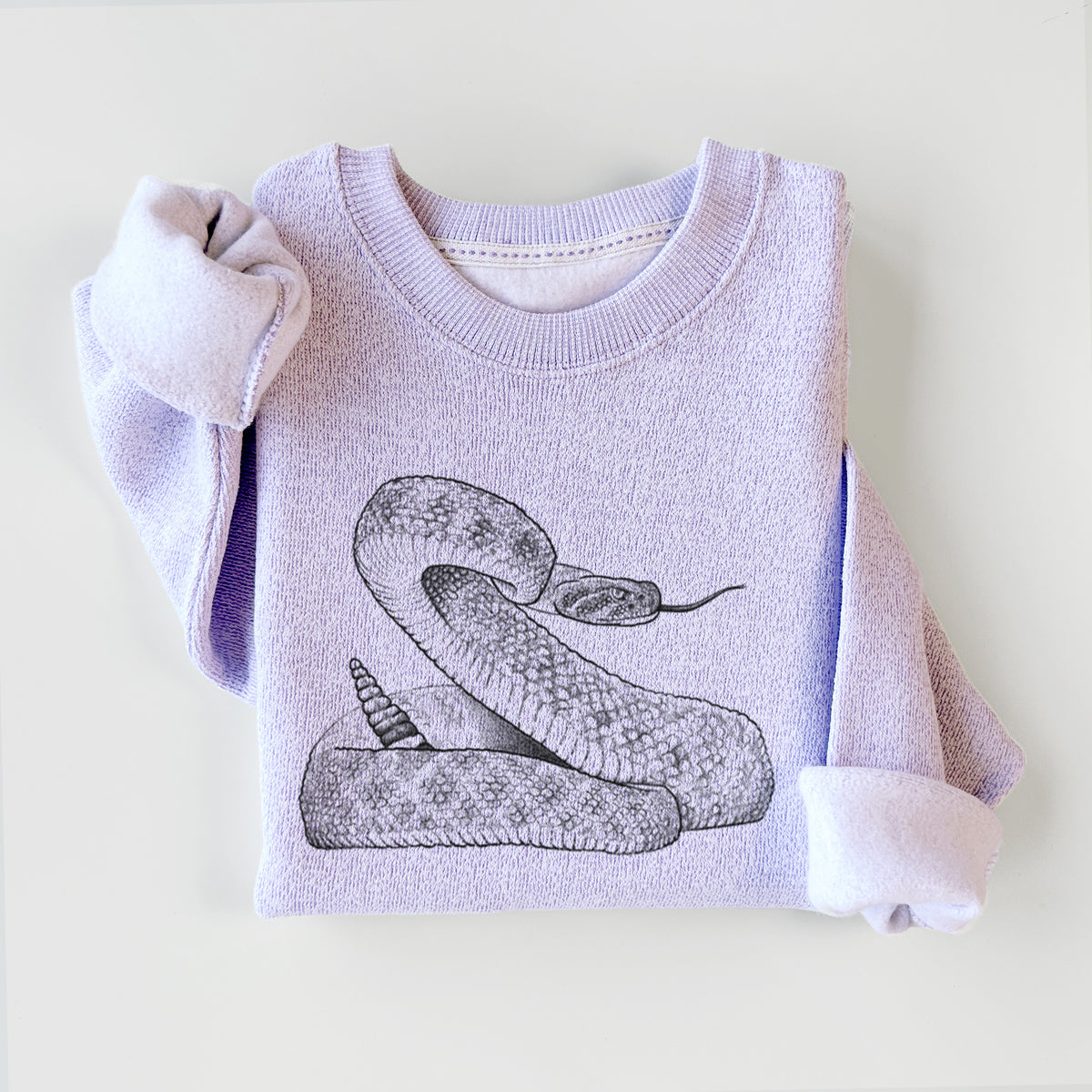 Ice purple knit sweatshirt printed with a detailed black ink illustration of a coiled diamondback rattlesnake, styled flat.