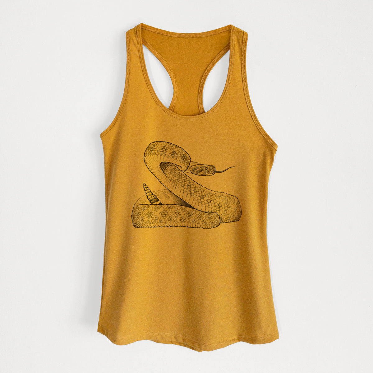 Gold women's racerback tank top laid flat, printed with a detailed black ink illustration of a coiled diamondback rattlesnake.
