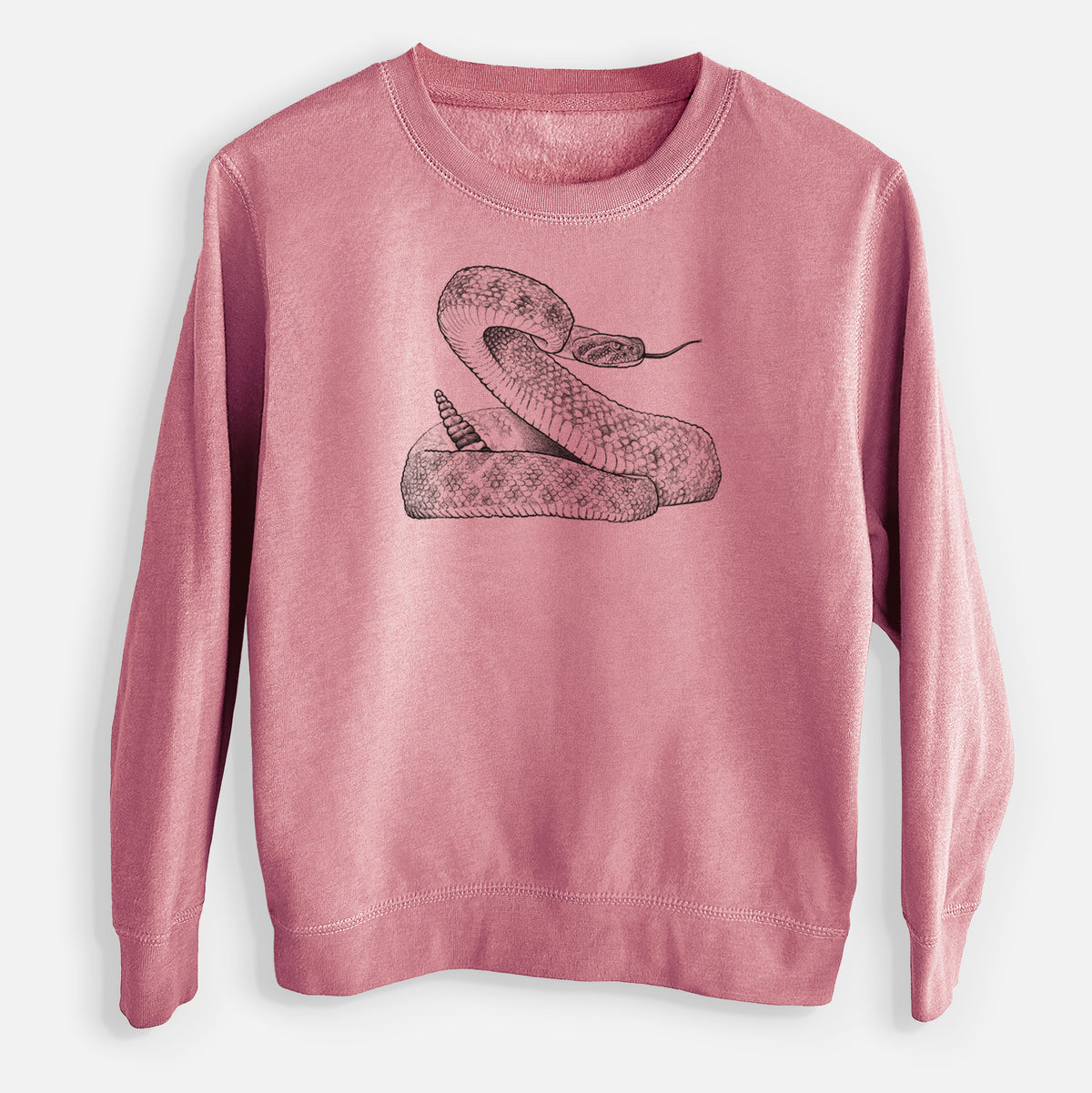 Mauve pink youth crewneck sweatshirt laid flat, printed with a detailed black ink illustration of a coiled diamondback rattlesnake.