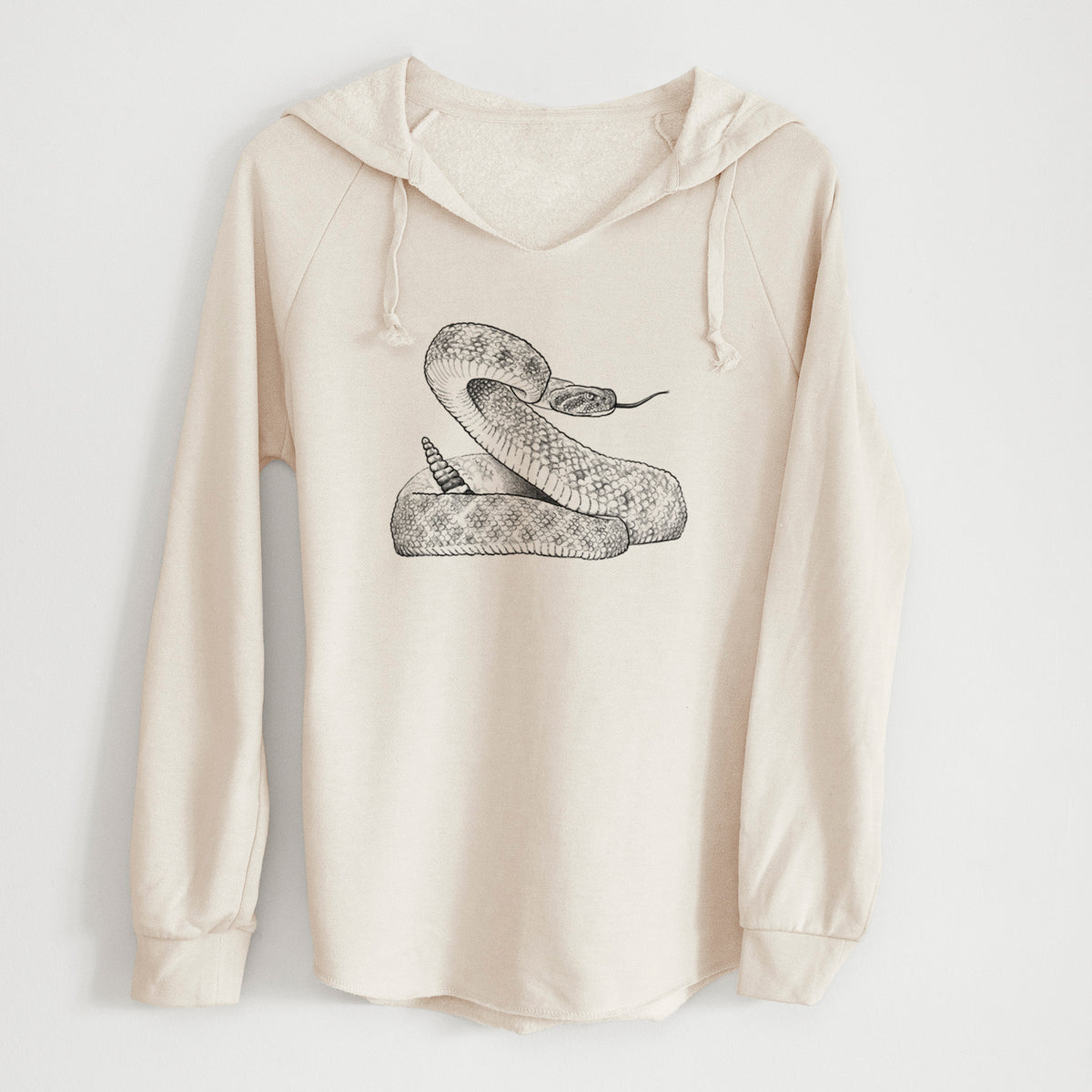 Bone cream women's Cali Wave hooded sweatshirt laid flat, printed with a detailed black ink illustration of a coiled diamondback rattlesnake.