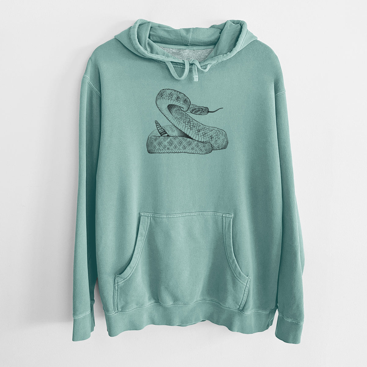 Mint green pigment dyed hoodie laid flat, printed with a detailed black ink illustration of a coiled diamondback rattlesnake.