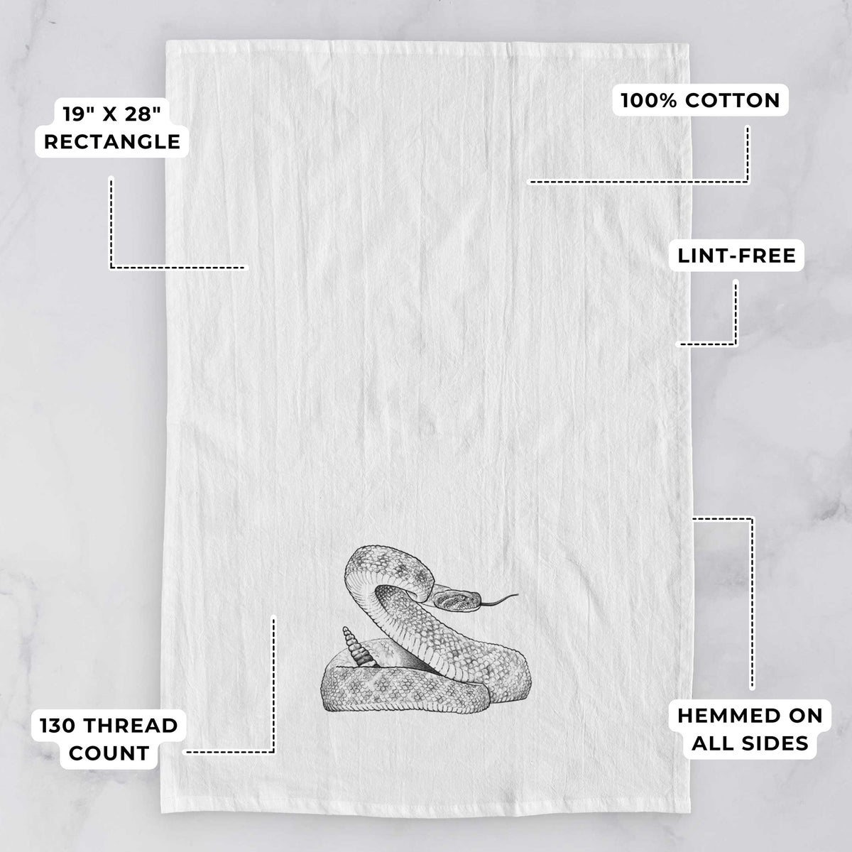 White tea towel printed with a detailed black ink illustration of a coiled diamondback rattlesnake, with feature labels: 19 by 28 inch rectangle, 100% cotton, lint-free, 130 thread count, hemmed on all sides.
