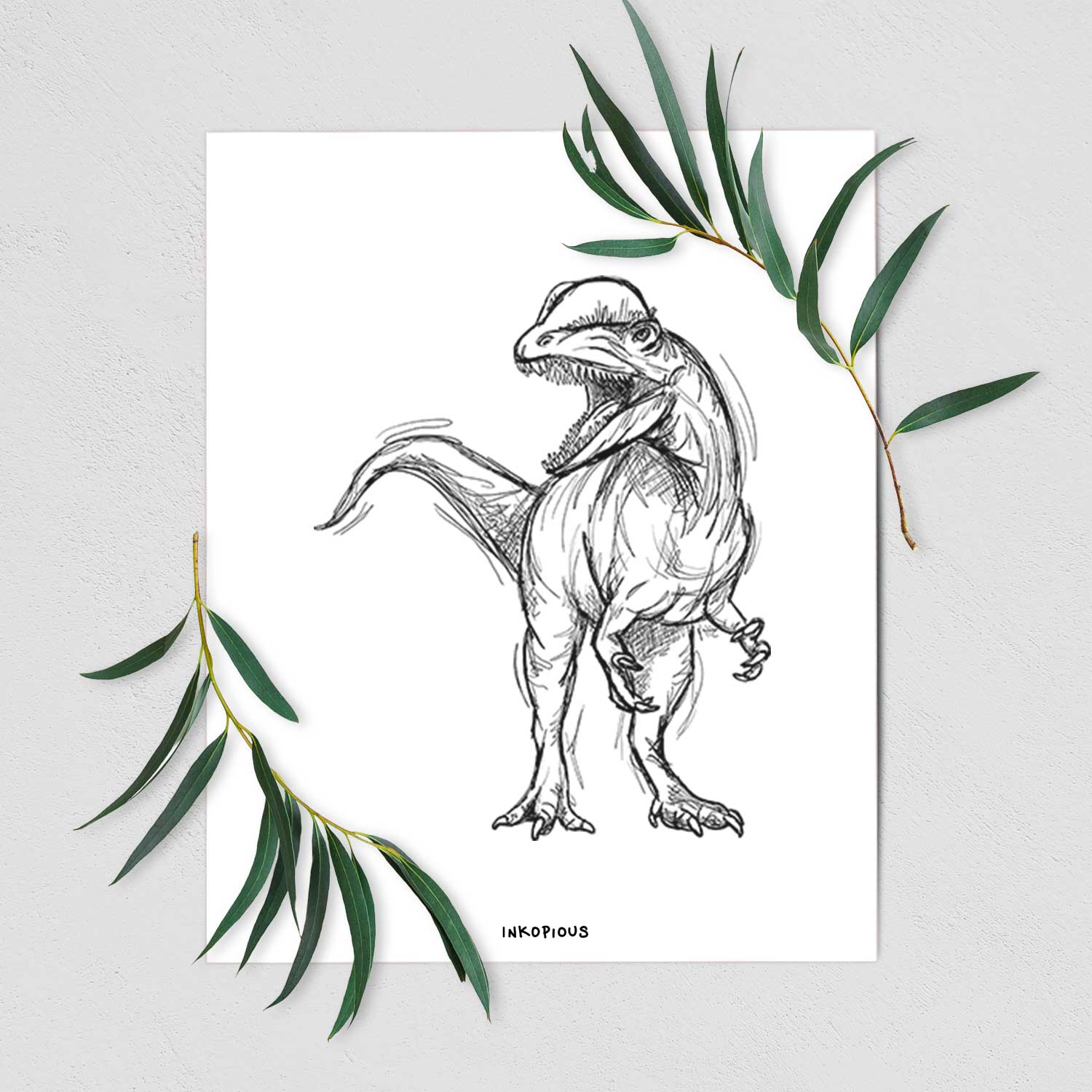 Art print of a black ink illustration of a Dilophosaurus with its neck frill, walking, shown with eucalyptus leaves.