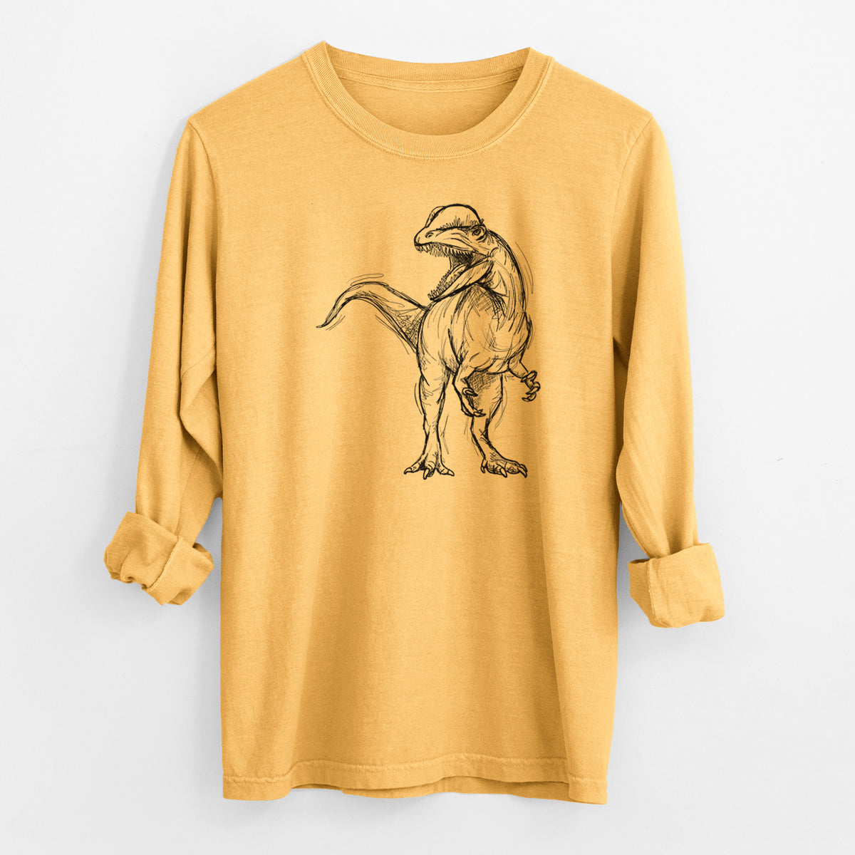 Golden wheat yellow Comfort Colors long sleeve shirt laid flat with the cuffs rolled, printed with a black ink illustration of a Dilophosaurus with its neck frill, walking.