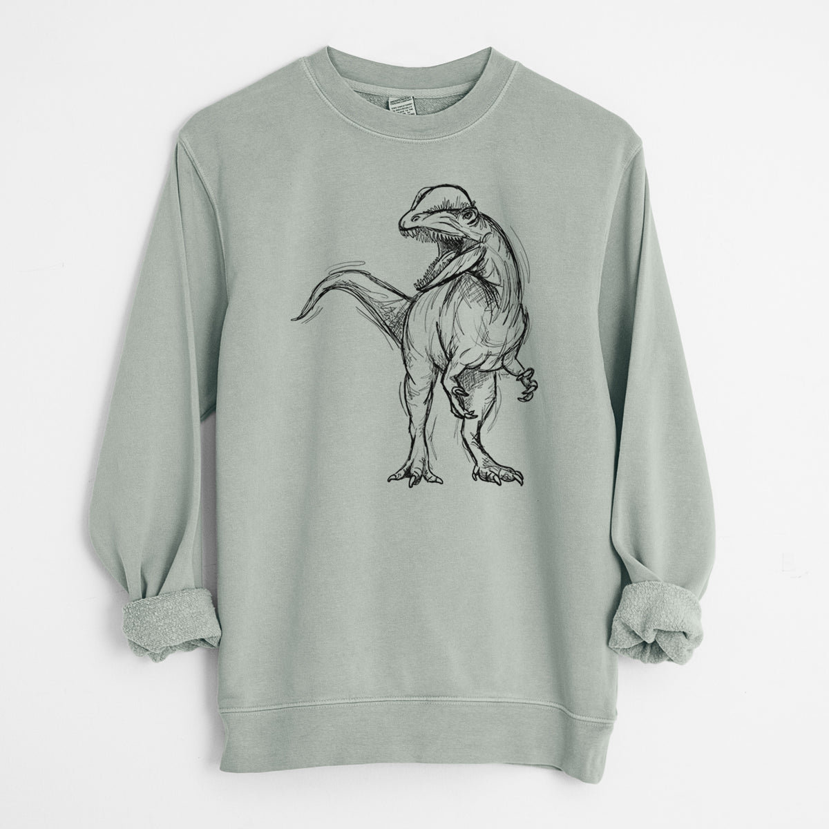 Sage green pigment dyed crewneck sweatshirt laid flat with the sleeves rolled, printed with a black ink illustration of a Dilophosaurus with its neck frill, walking.