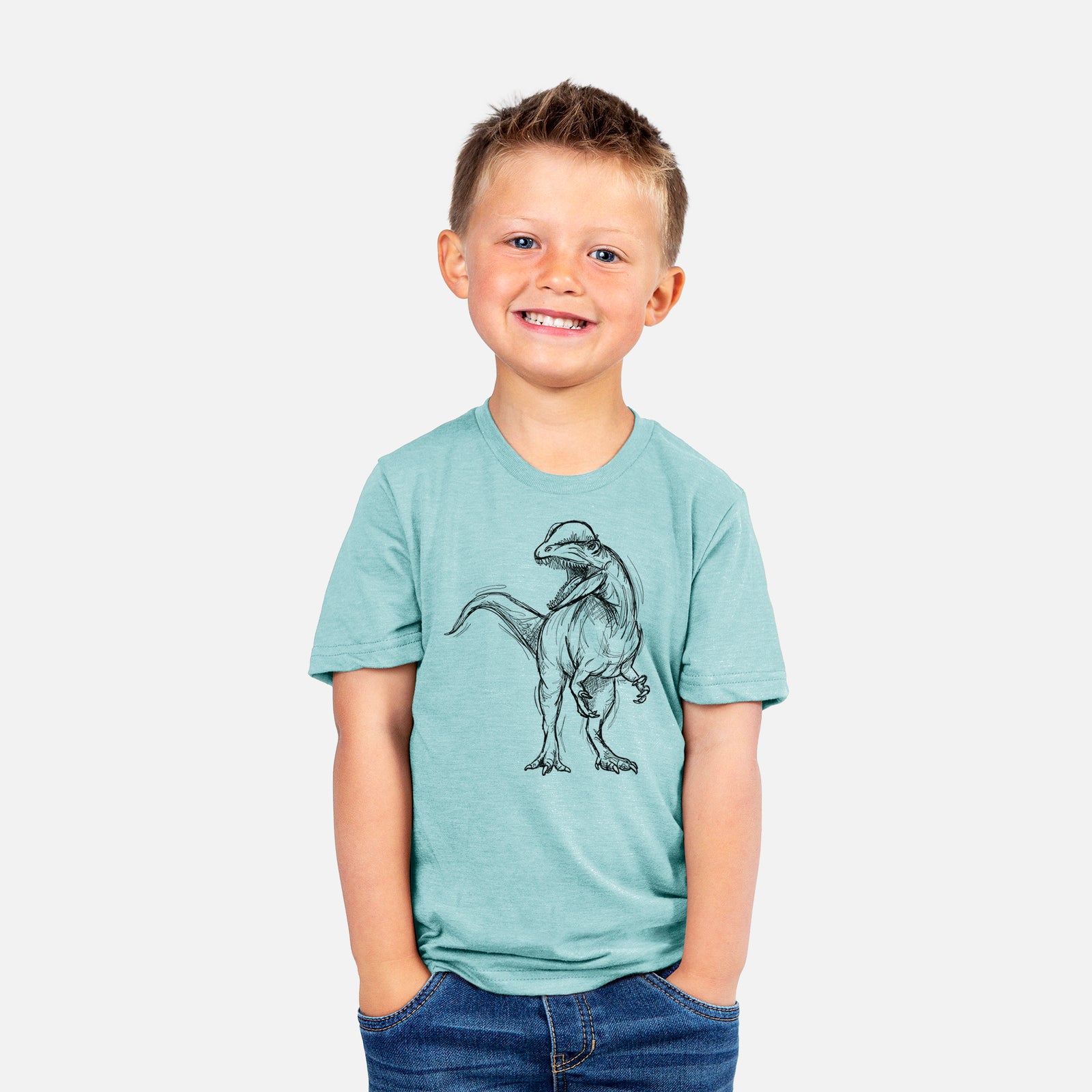 Two youth t-shirts in different colors on hangers, printed with a black ink illustration of a Dilophosaurus with its neck frill, walking.