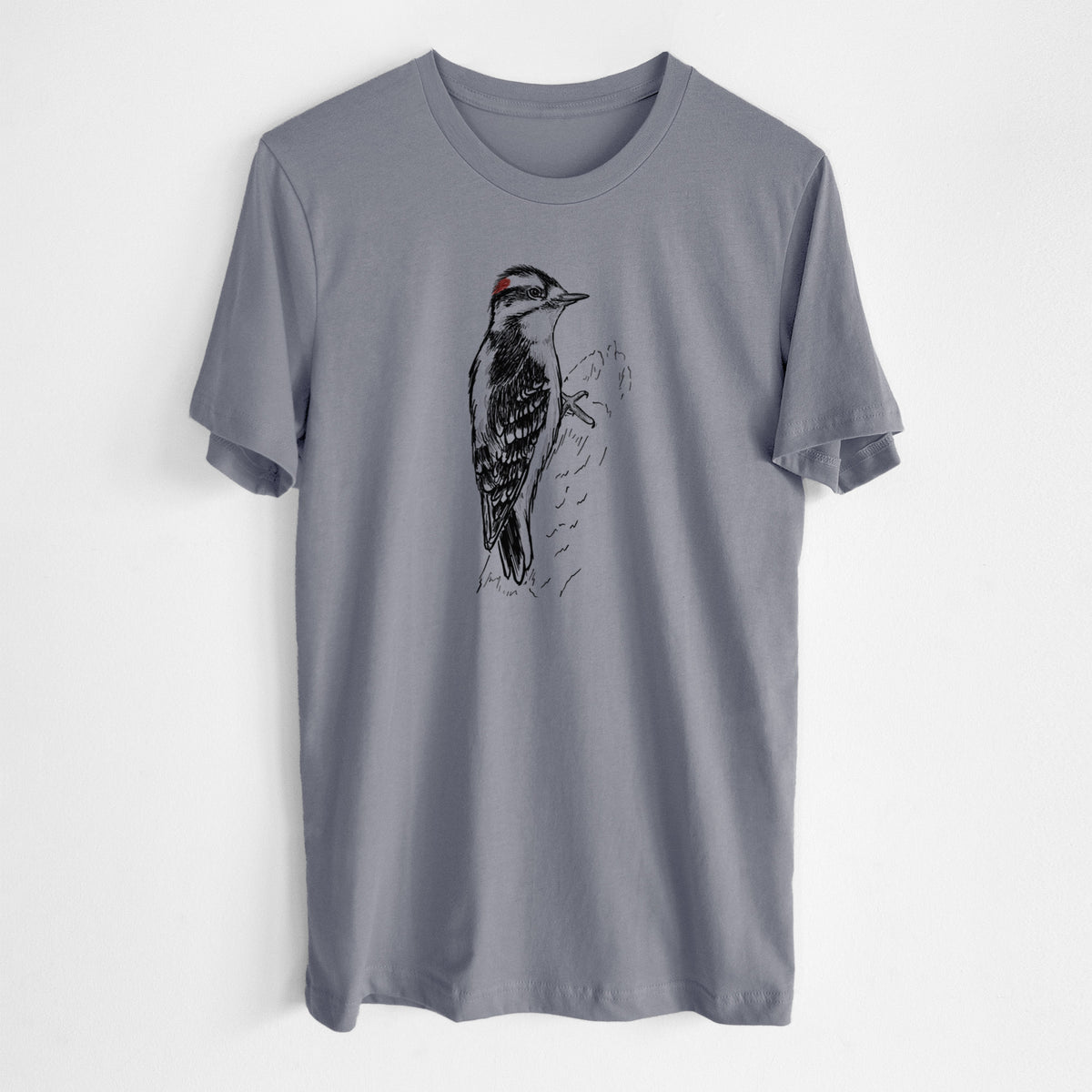Storm grey lightweight cotton t-shirt laid flat, printed with a detailed black ink illustration of a downy woodpecker clinging to a tree trunk.